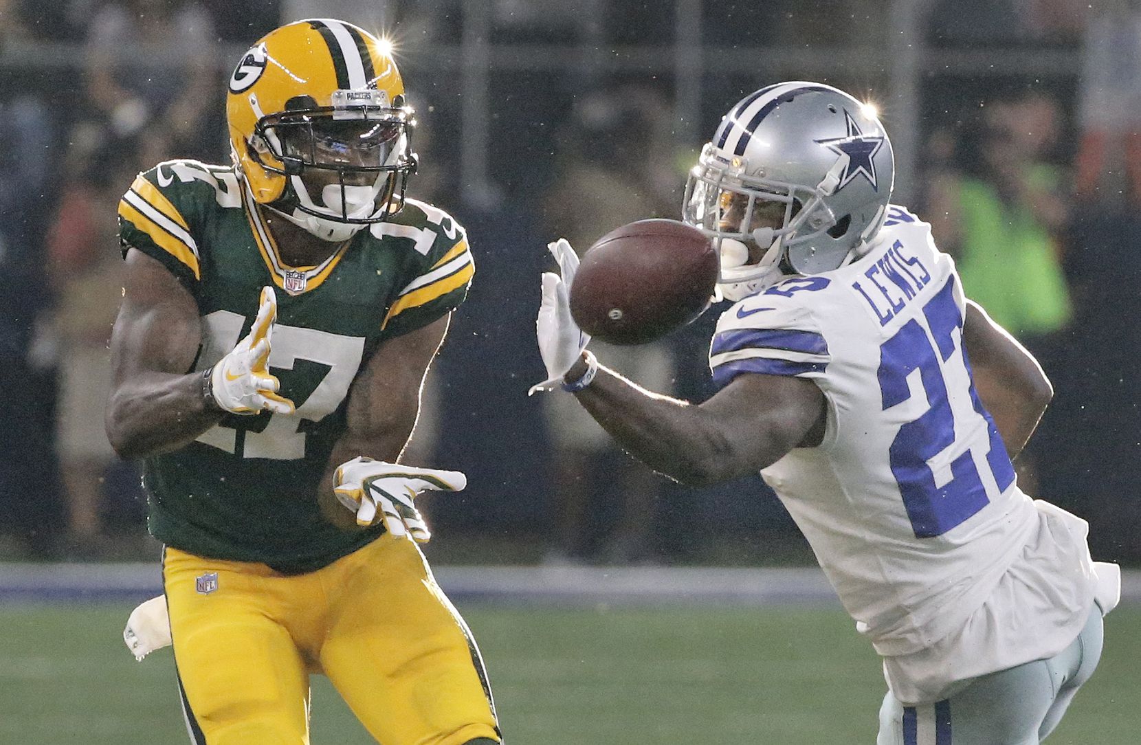FILE - Cowboys cornerback Jourdan Lewis (27) tries to break up a pass intended for Packers...