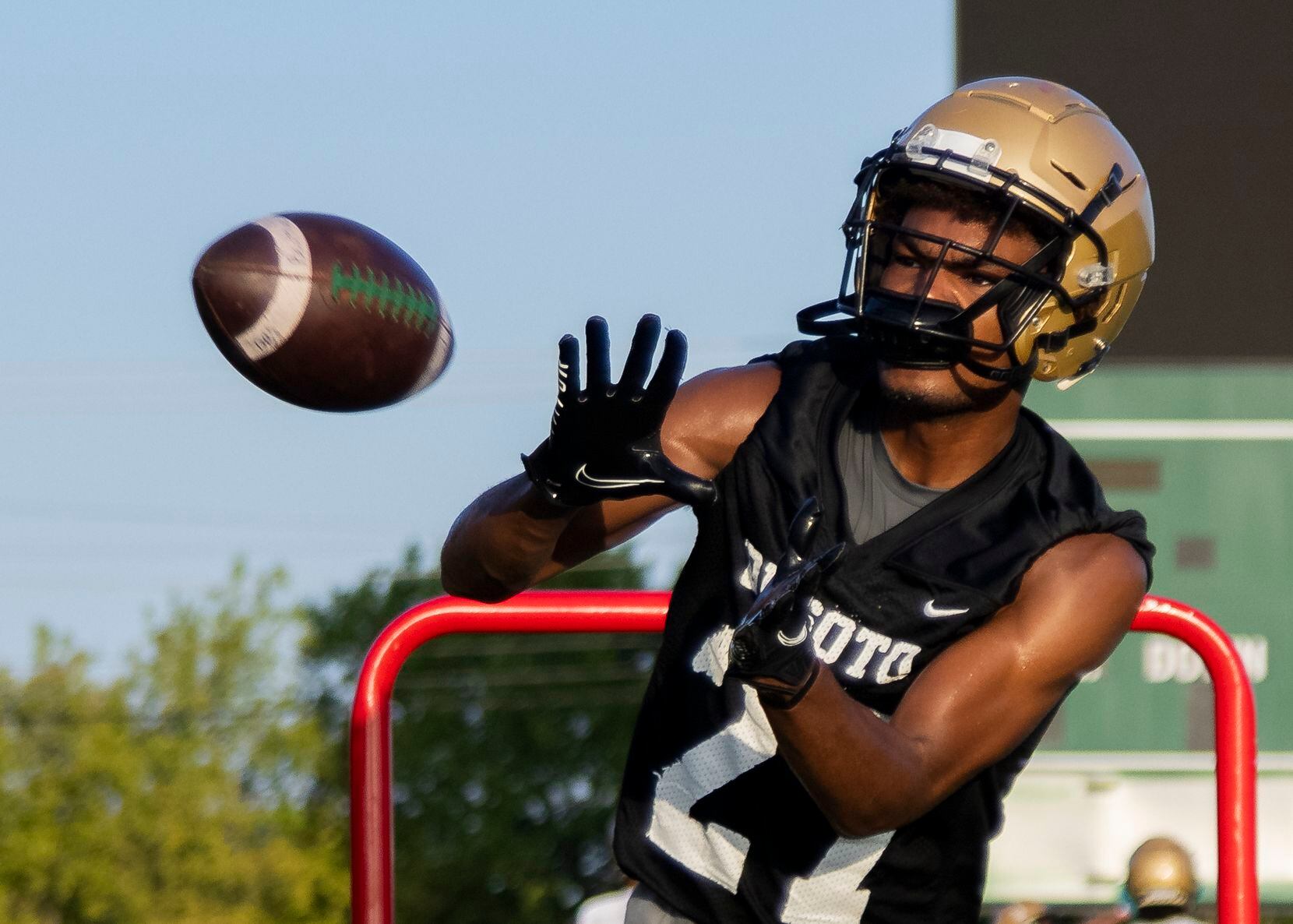 DeSoto’s DeMichael Porter catches the ball during the first practice of the season on...