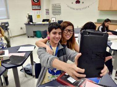 Mohammad Faroz takes a selfie with math teacher Thuy Nguyen.