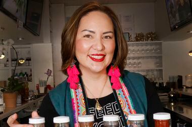 Asian Mint restaurant Co-Founder and Chef Nikky Phinyawatana shows her source collection at...