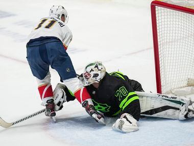 Dallas Stars goaltender Braden Holtby (70) turns away Florida Panthers left wing Jonathan...