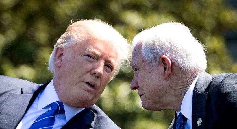 President Donald Trump talks to Attorney General Jeff Sessions before Trump's speech at the 36th Annual National Peace Officers Memorial Service on May 15 in Washington. Few Republicans were quicker to embrace Trump's campaign than Sessions, but the president has grown sour on the attorney general, blaming him for various troubles that have beset the White House.