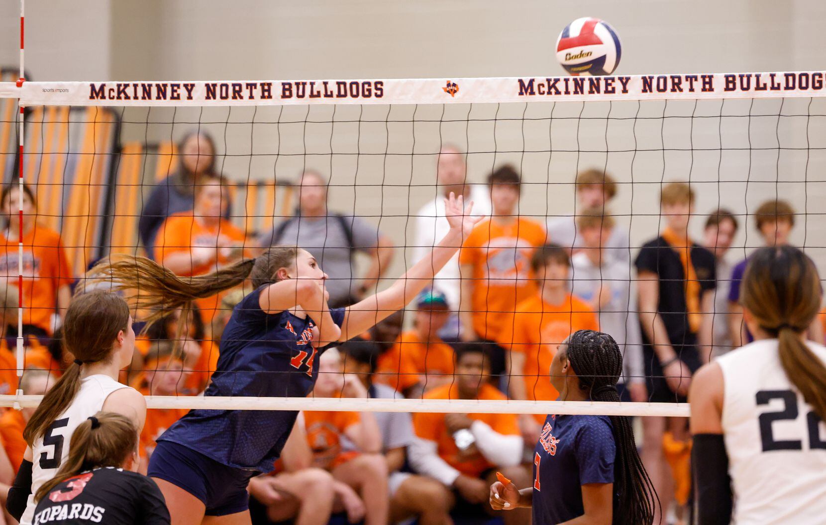 McKinney North Brooke Butler (14) dives for the ball in the fourth set of a match against...