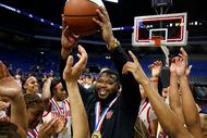 Duncanville coach Neiman Ford celebrates after the UIL Class 6A girls basketball state...