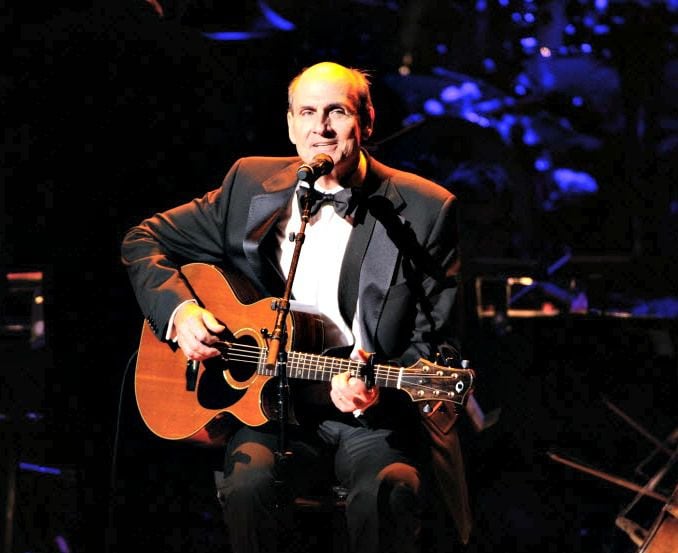 James Taylor performs at the 25th Anniversary Rainforest Fund benefit concert at Carnegie...