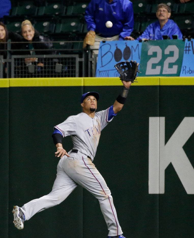 Texas Rangers right fielder Carlos Gomez in action against the Seattle Mariners in a...