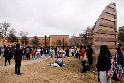 Students take turns speaking Thursday on the University Union's south lawn during a protest...