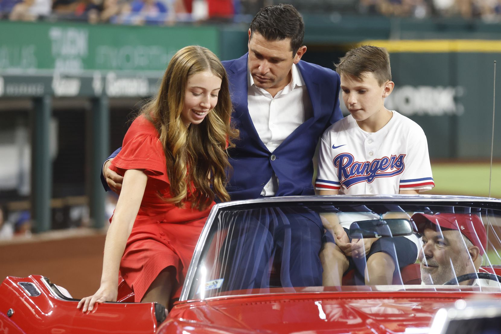 Former Texas Ranger Ian Kinsler, exits with his daughter Rian and son Jack during Rangers...