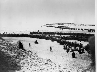 Allied troops wait on the beach of Dunkirk for the rescue ships to take them to England  on...