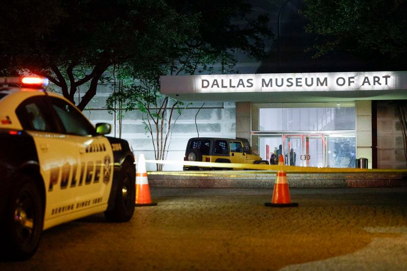 A Dallas police car sits outside of the Dallas Museum of Art after a 21-year-old man broke...