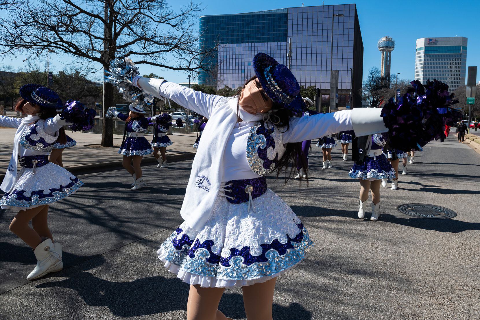 Perla Sanchez, with Sunset High School, performs during the Celebration of Champions Parade,...