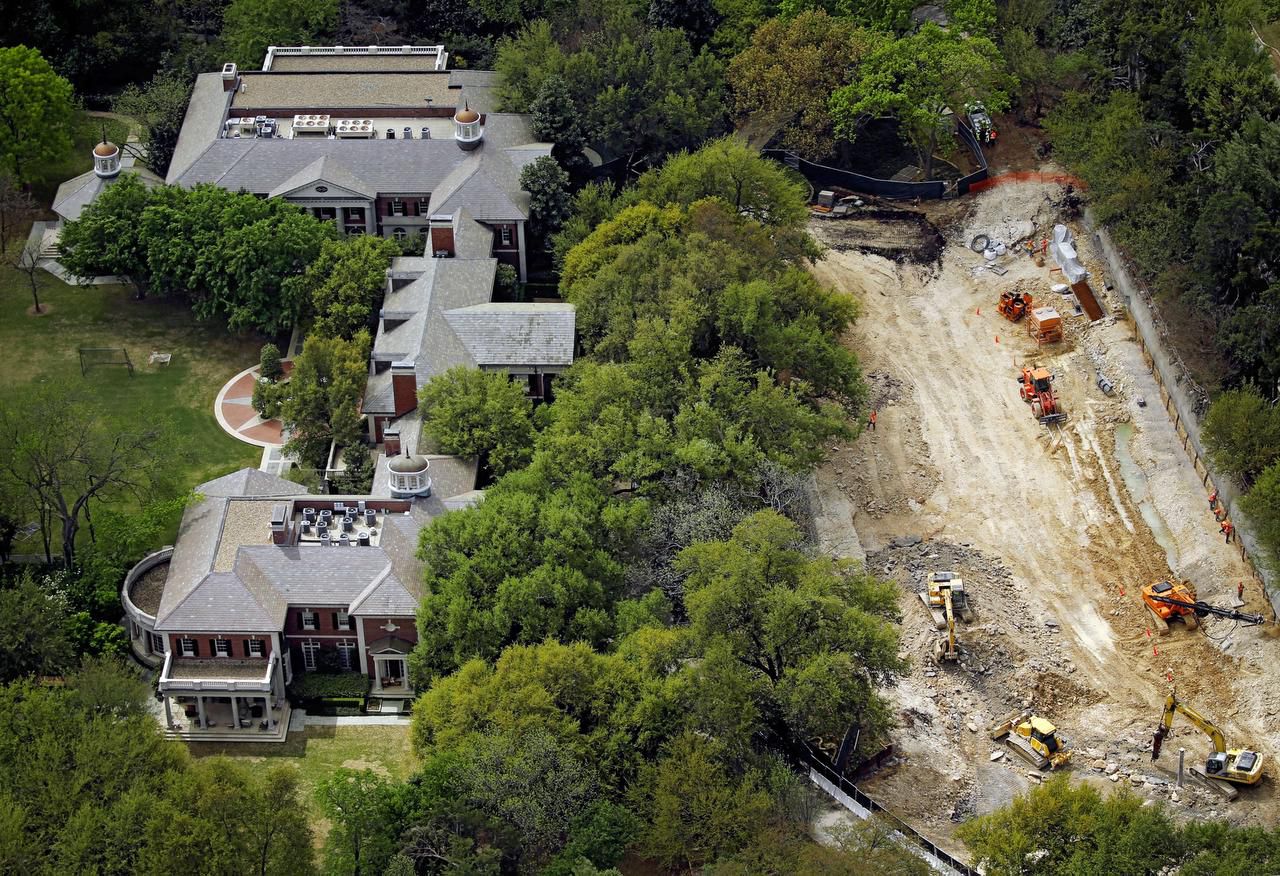 
Heavy equipment is carving out an underground garage at the Highland Park home of Harlan...