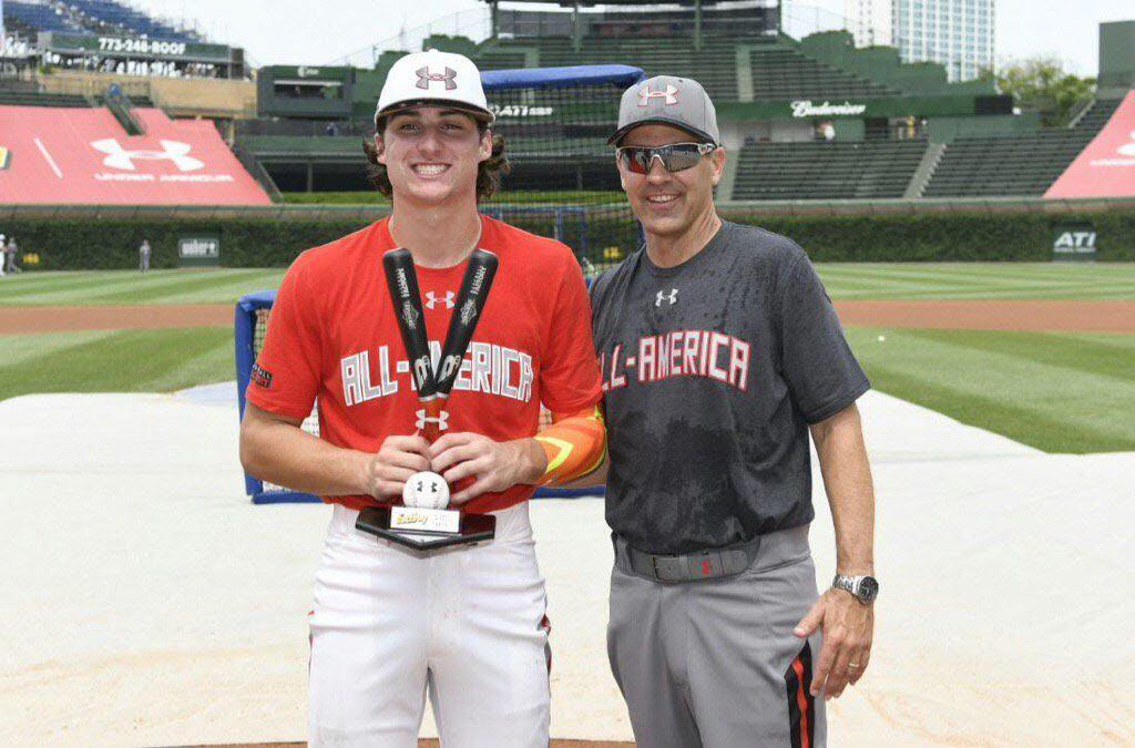 Frisco's Ryan Vilade poses with Steve Bernhardt after winning the Eastbay Home Run Derby...