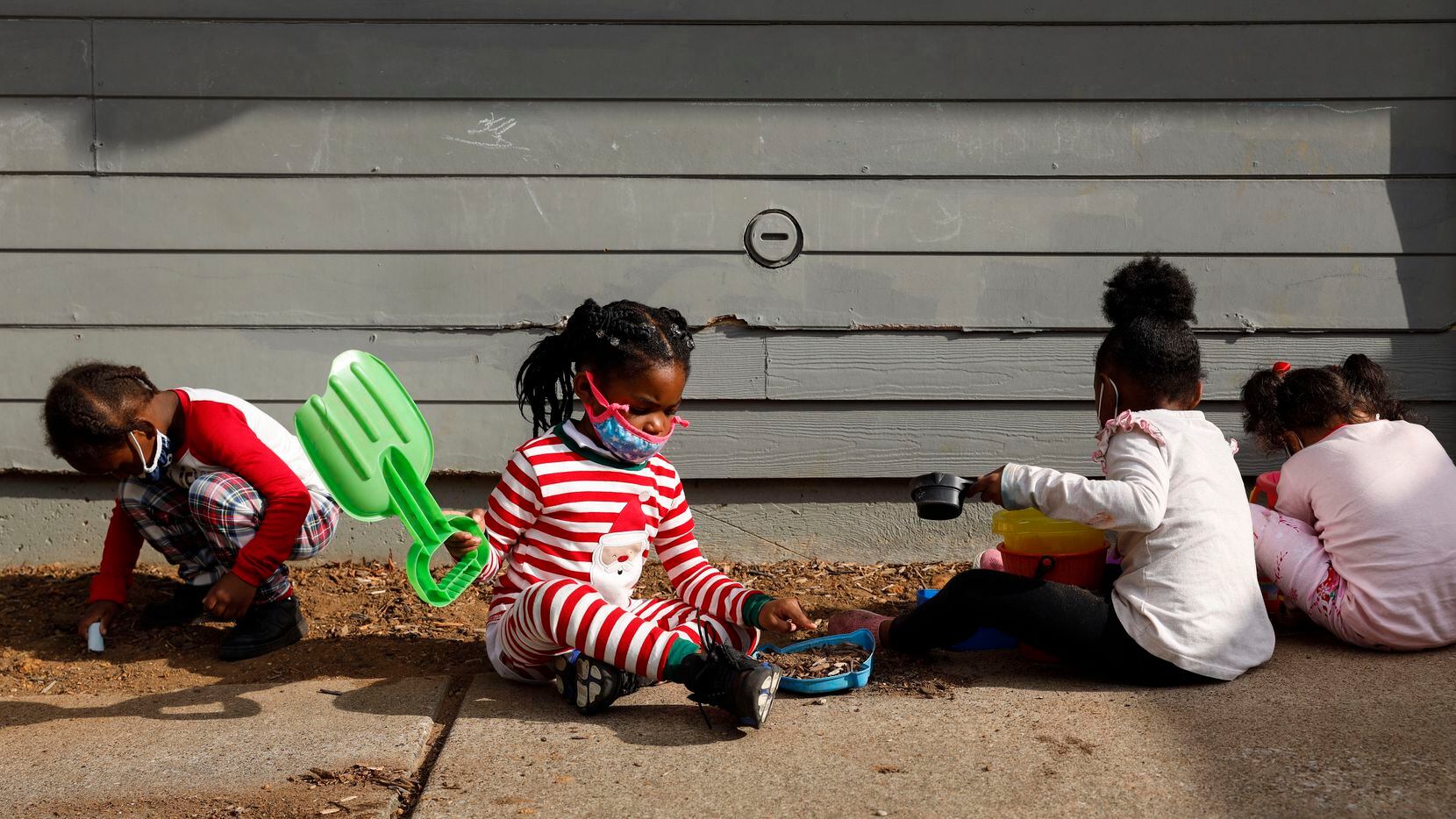 Children play outside at Child Care Group's Landauer Center in Dallas on Dec. 16, 2021.
