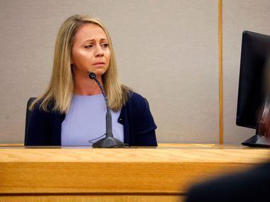 Fired Dallas police officer Amber Guyger becomes emotional as she testifies during her...