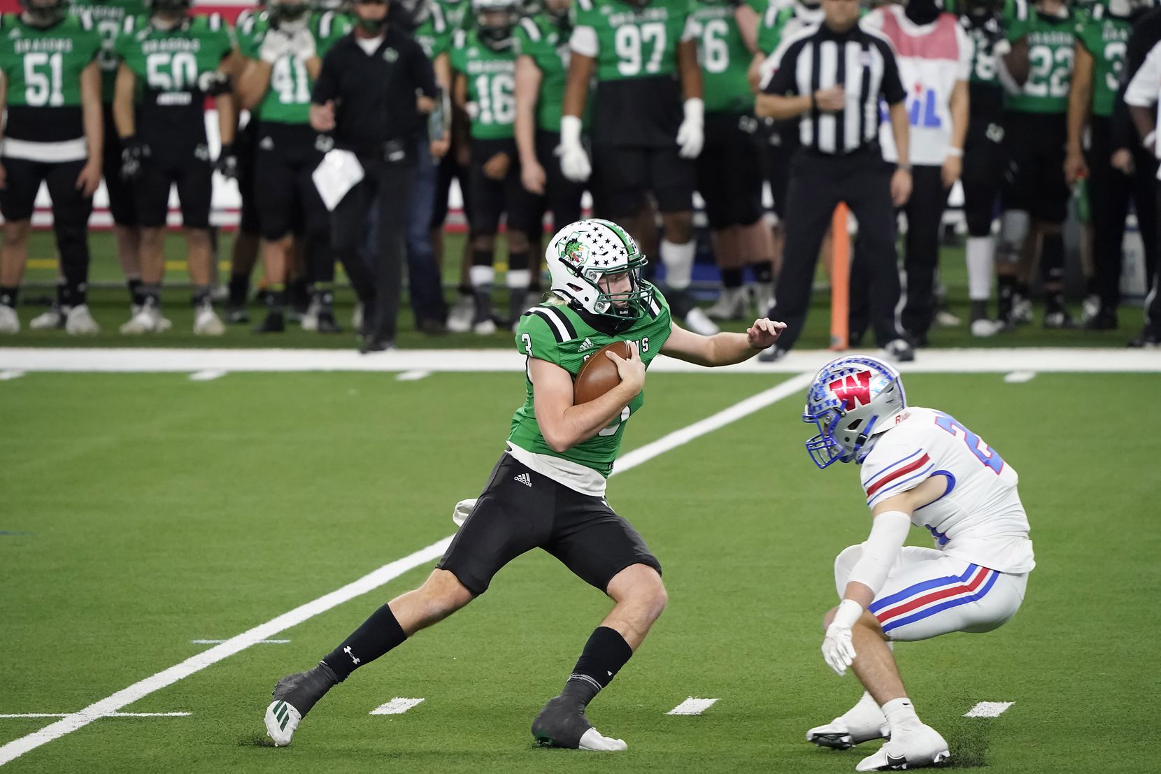 Southlake Carroll quarterback Quinn Ewers (3) tries to get past Austin Westlake defensive back Patrick Churchill (24) during the second quarter of the Class 6A Division I state football championship game at AT&T Stadium on Saturday, Jan. 16, 2021, in Arlington, Texas.