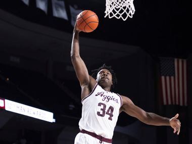 Texas A&M forward Julius Marble (34) goes for a dunk during the second half of an NCAA...