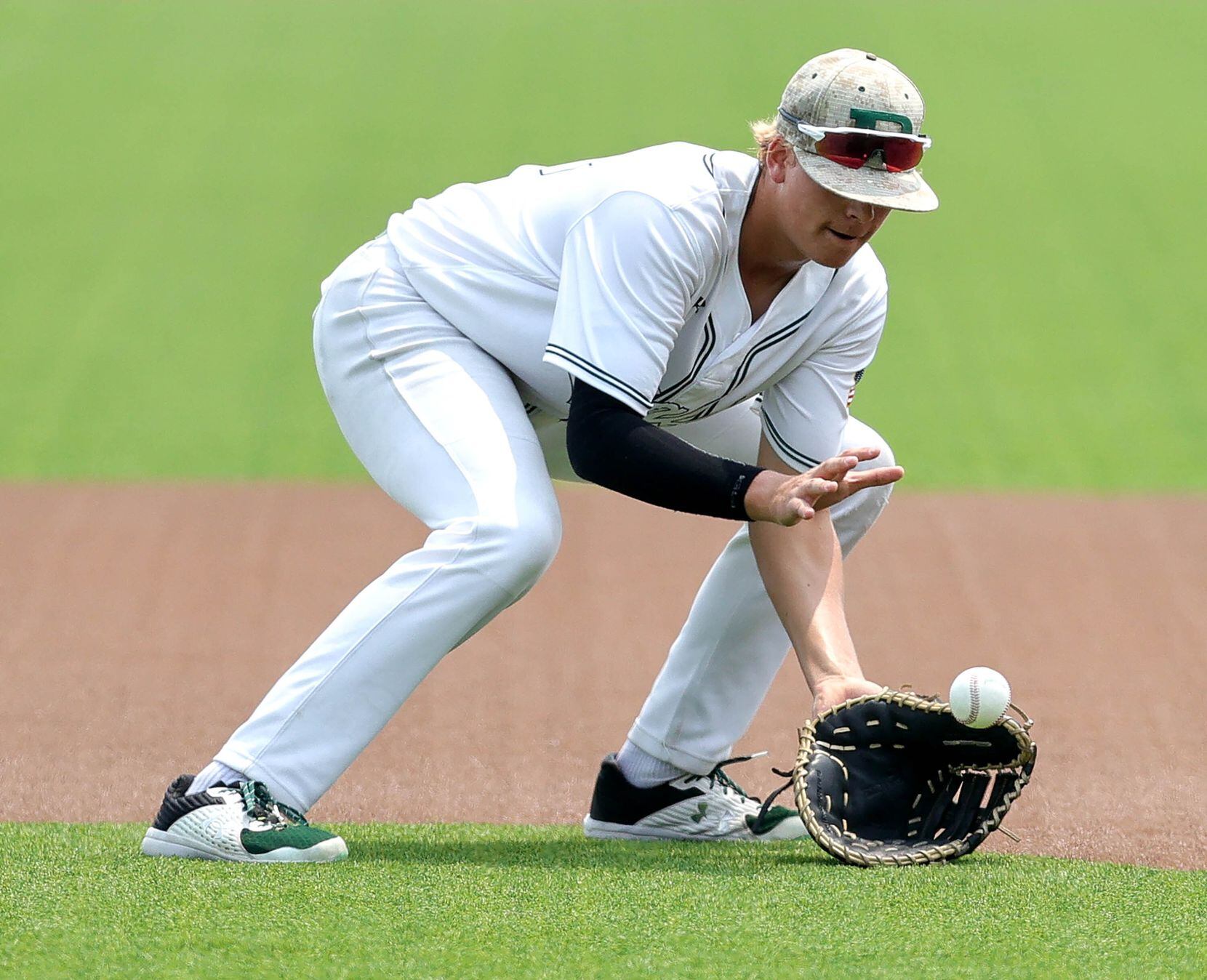 Prosper first baseman Jason Miller fields the ball against Coppell during game 3 of the 6A...