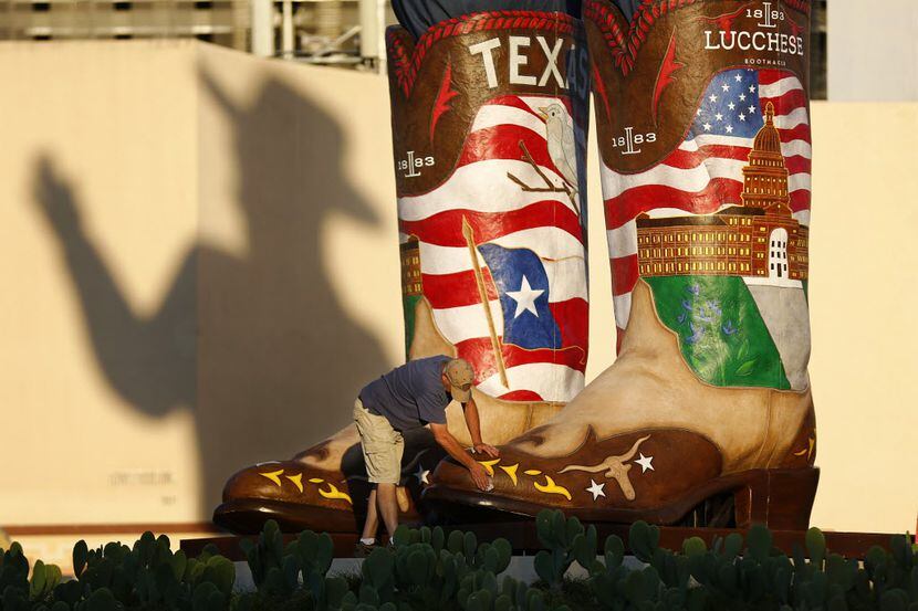 BOOT SCOOTIN': Big Tex's boots are 10 feet, 6 inches long and weight about 900 pounds each....
