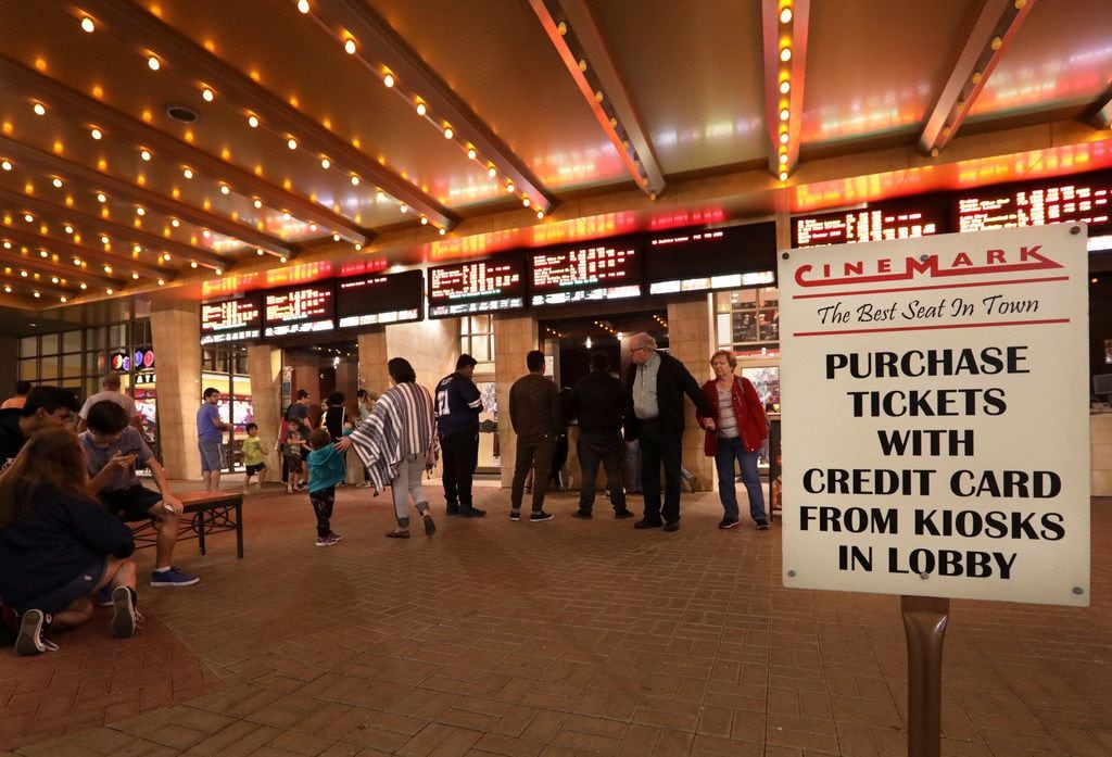 Customers purchase tickets at a Cinemark movie theater in Plano, TX, on Dec. 2, 2017. (Jason...
