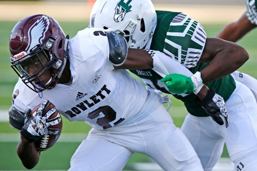 In this file photo, Rowlett High School wide receiver Antonio Hull Jr (2) is tackled by...