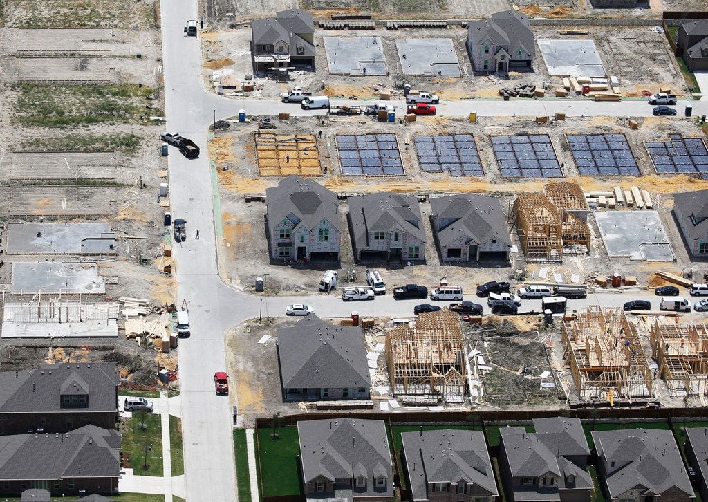 Homes under construction in McKinney. In Texas, 84% of firms surveyed by the Association of...