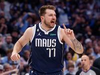 Dallas Mavericks guard Luka Doncic (77) reacts during the first half of an NBA game against...