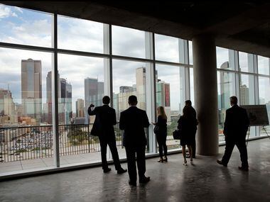 Uber executives and guests take in the Dallas skyline from the 12th floor of The Epic.