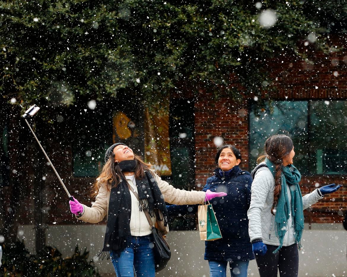 Visitors Yolotzin Ojeda of Guanajuato, Mexico, records herself as she witnesses snow for the...