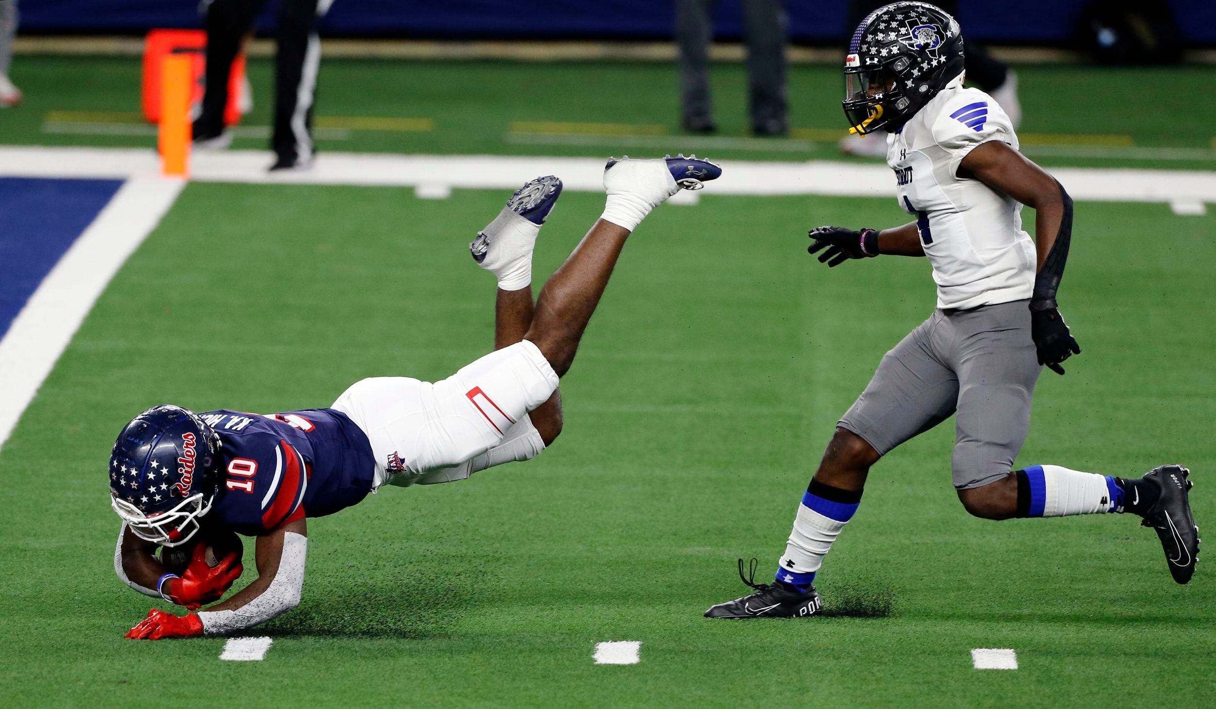Denton Ryan’s Kalib Hicks (10) dives for the end zone, but comes up a yard short, as...