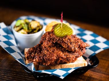 Nashville hot chicken is fried chicken coated with a cayenne-based spice blend. It can be crazy spicy or it can be mild: It's all about which level of heat you choose. Here, fried chicken from Palmer's Hot Chicken in East Dallas is served with white bread and pickles.