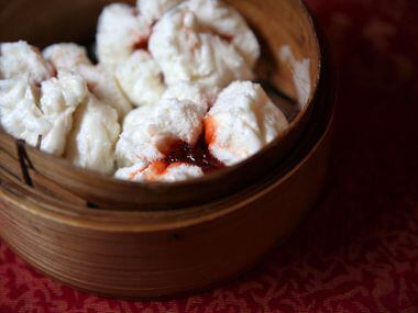 Char siu bao (steamed pork buns) at Kirin Court. They're filled with chopped pork in a sweet...