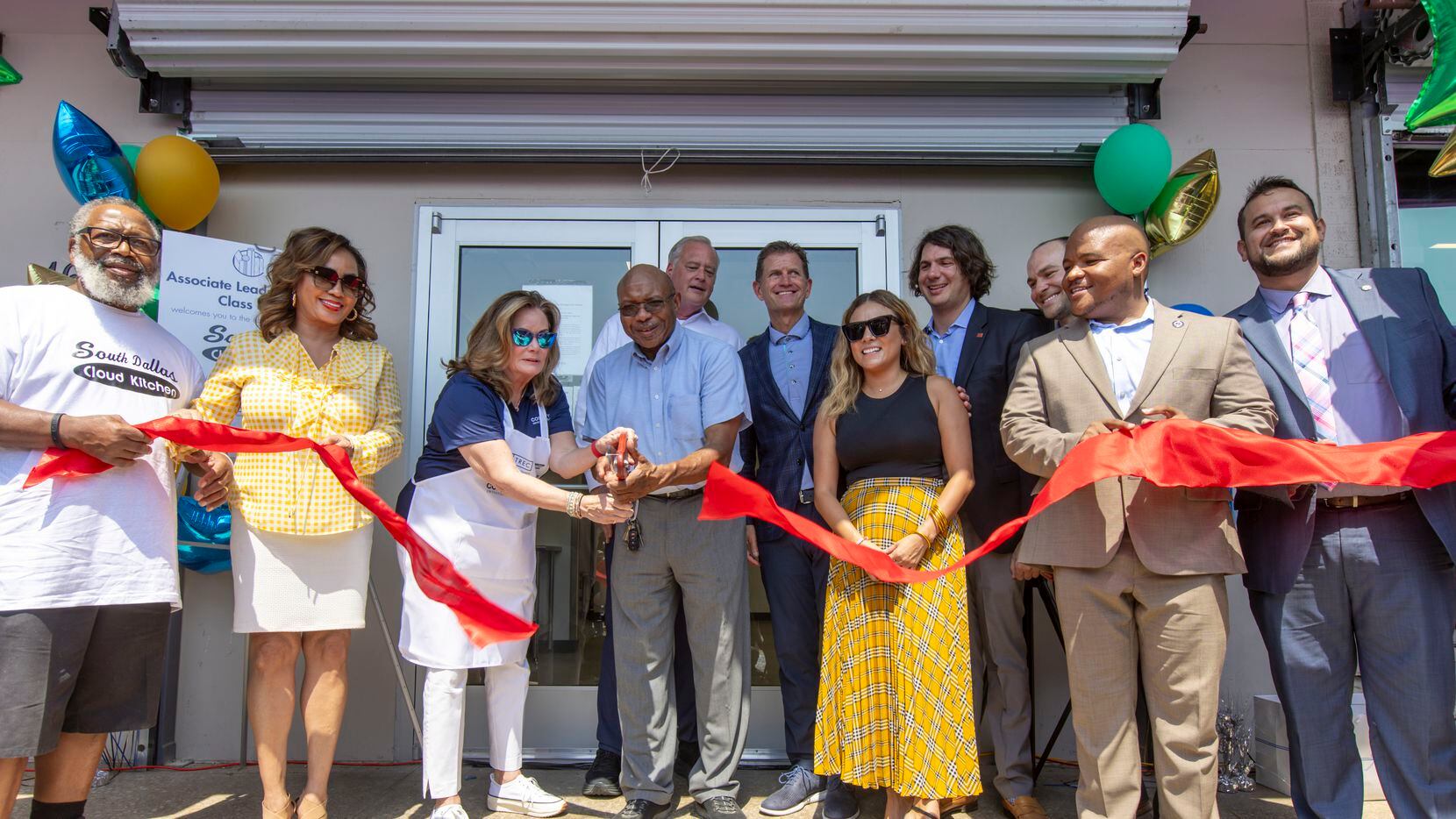 Community leaders cut the ribbon for the grand opening of the South Dallas Cloud Kitchen in...