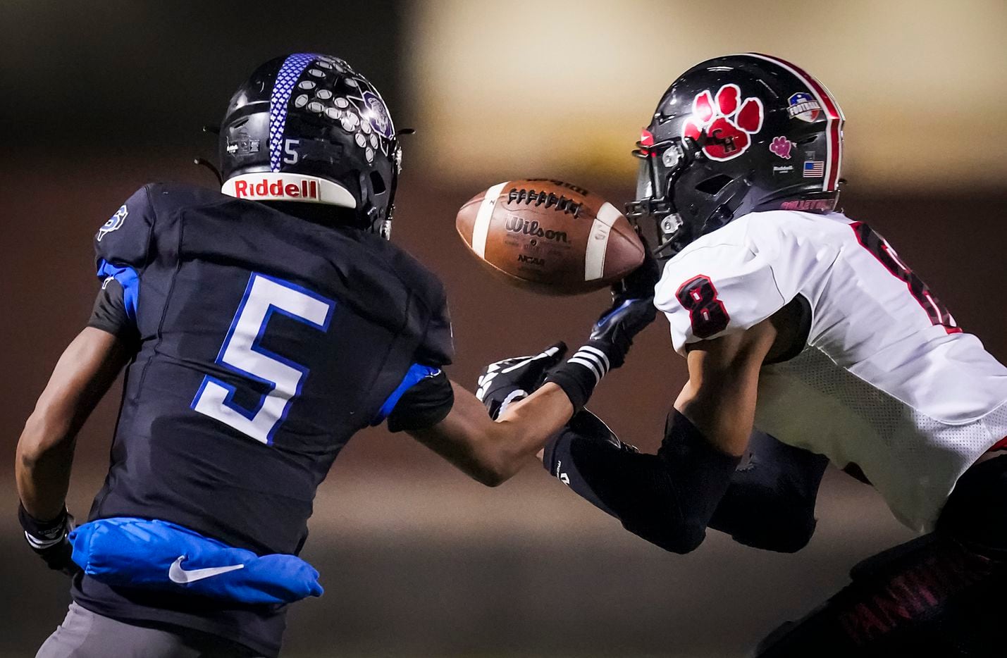 Colleyville Heritage defensive back Dylahn McKinney (8) breaks up a pass intended for Mansfield Summit wide receiver Bryan Spotwood Jr. (5) during the first half of the Class 5A Division I Region I final on Friday, Dec. 3, 2021, in North Richland Hills, Texas. (Smiley N. Pool/The Dallas Morning News)