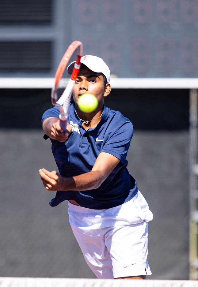Frisco Centennial’s Aravind Sridhar returns a shot during a doubles match with partner...
