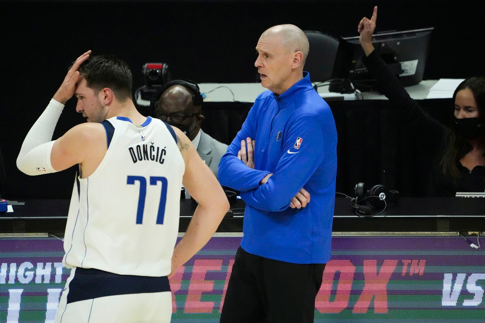 Dallas Mavericks guard Luka Doncic (77) and head coach Rick Carlisle react after a foul call...