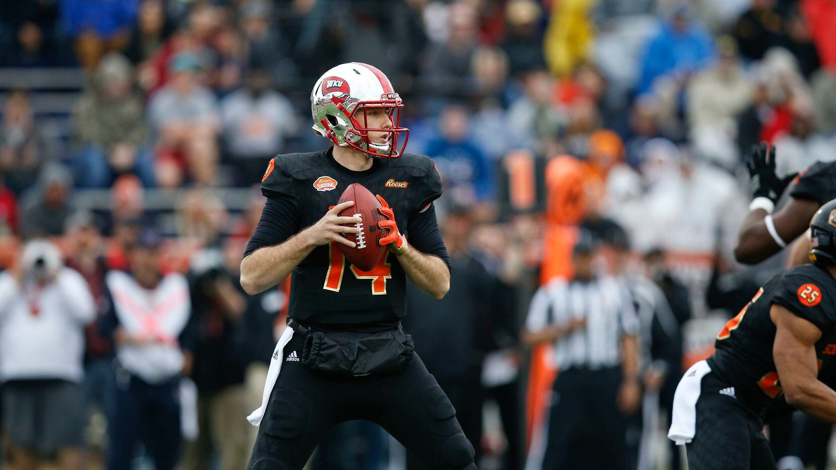South Squad quarterback Mike White of Western Kentucky (14) during the first half of the...
