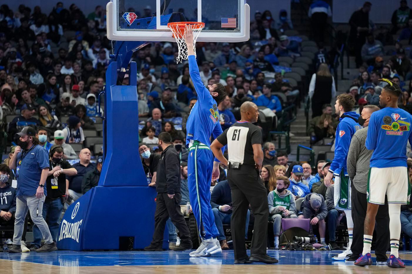 Dallas Mavericks center Boban Marjanovic  checks a new basket during the first half of an...