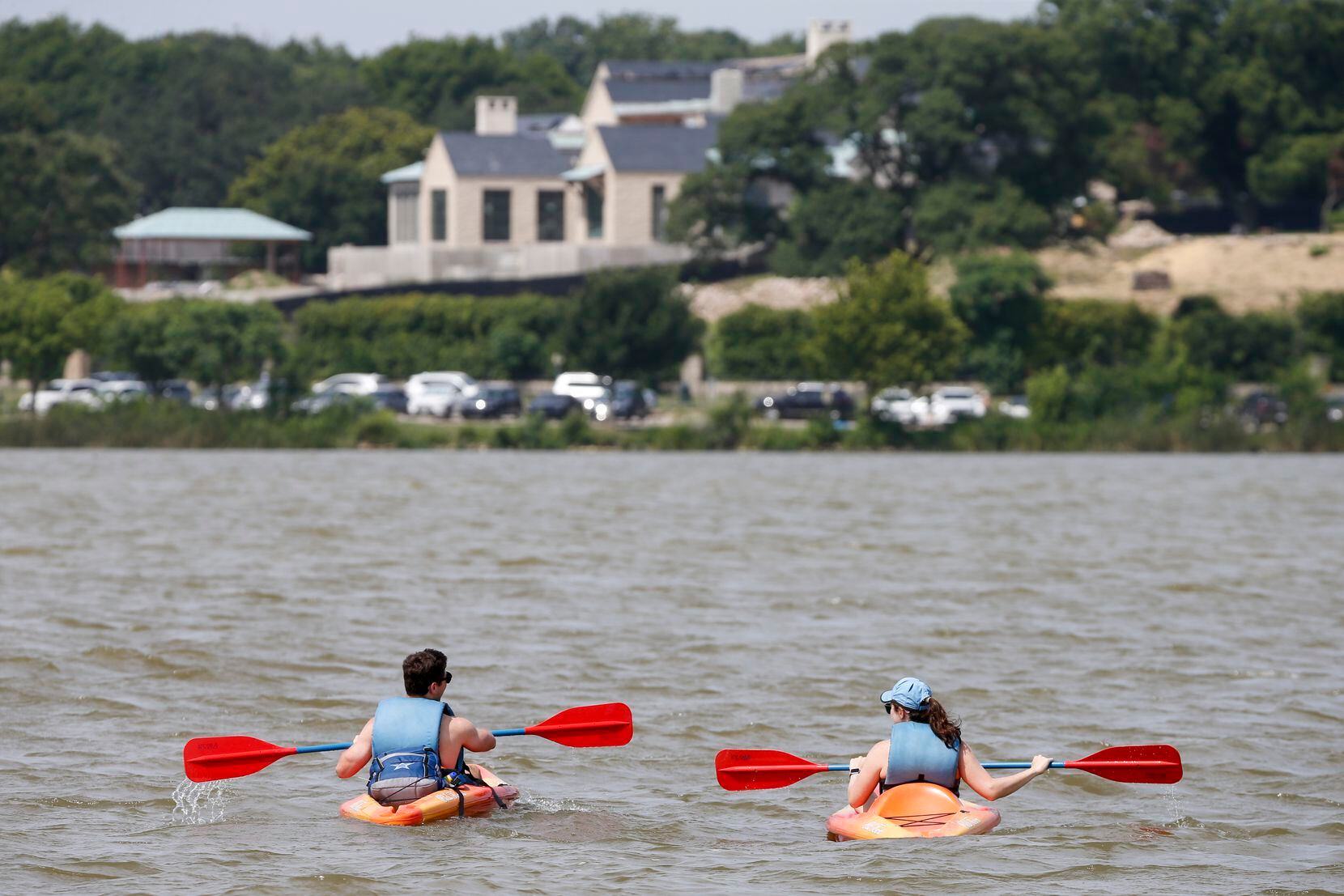 A couple kayak at White Rock Lake on Saturday, July 17, 2021, in Dallas.