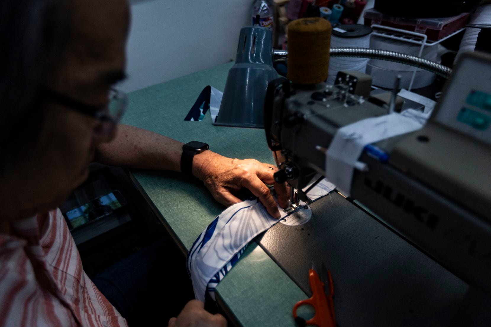 Finley Shirts sample maker Hoang Pham sews together pieces of fabric at the company’s design...