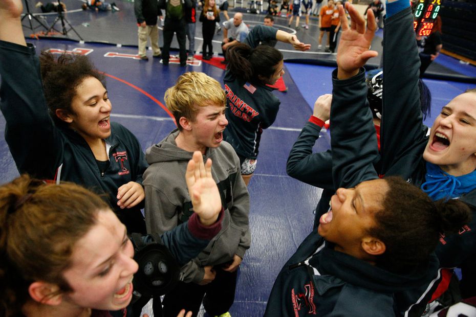 Euless Trinity's Mack Beggs (center) cheers with his team during the finals of the UIL...