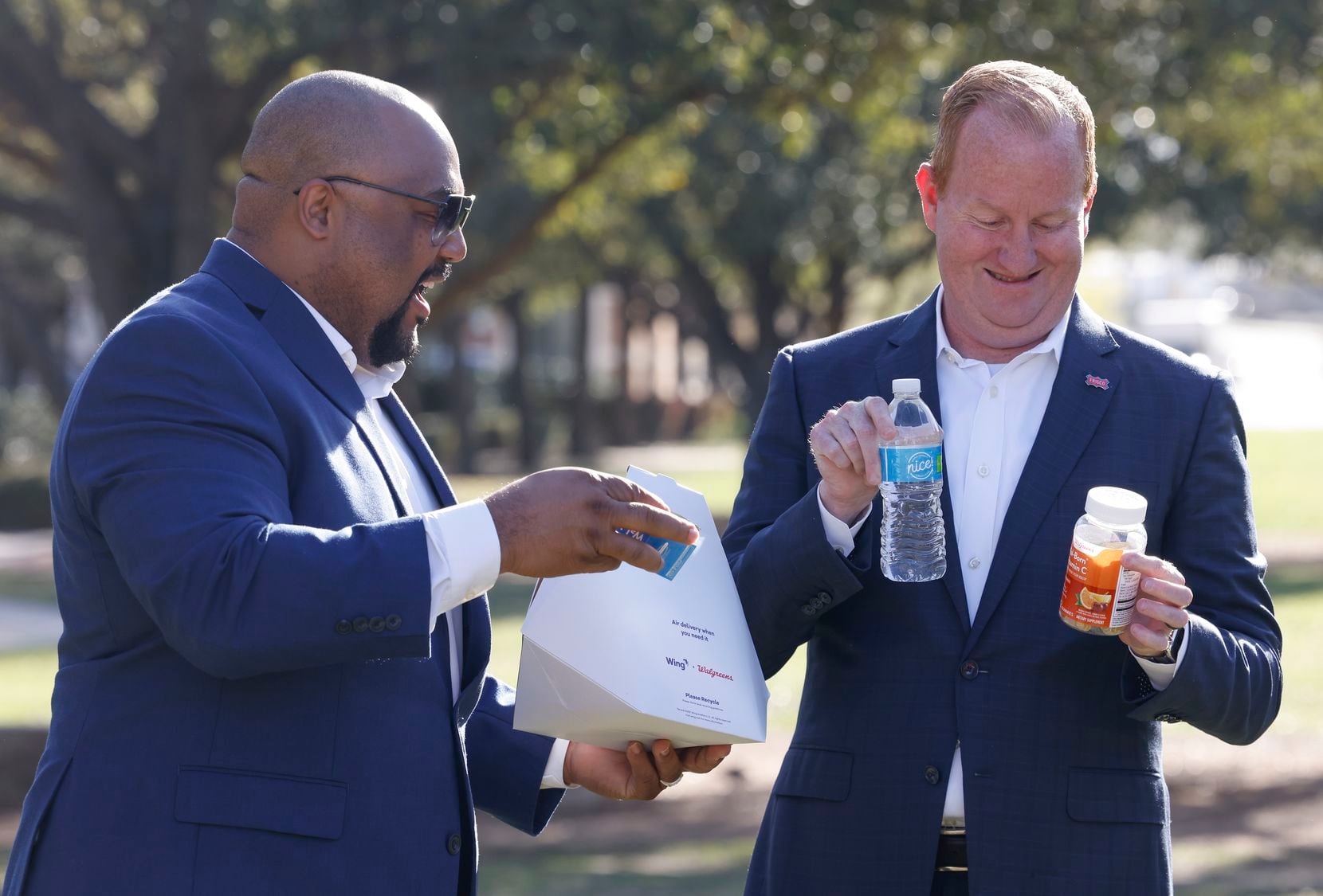Frisco Mayor Jeff Cheney, right, and Little Elm Mayor Curtis J. Cornelious take the orders...