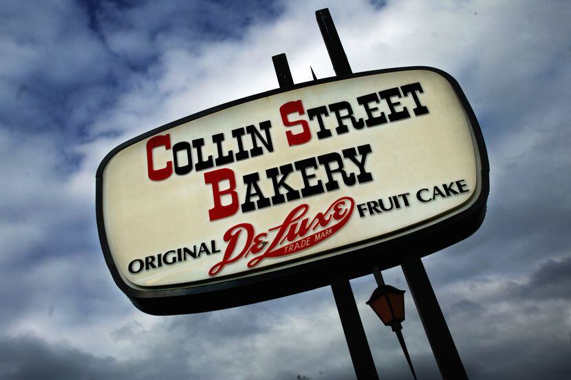 In this 2003 file photo, the sign for Collin Street Bakery stands out against the sky.