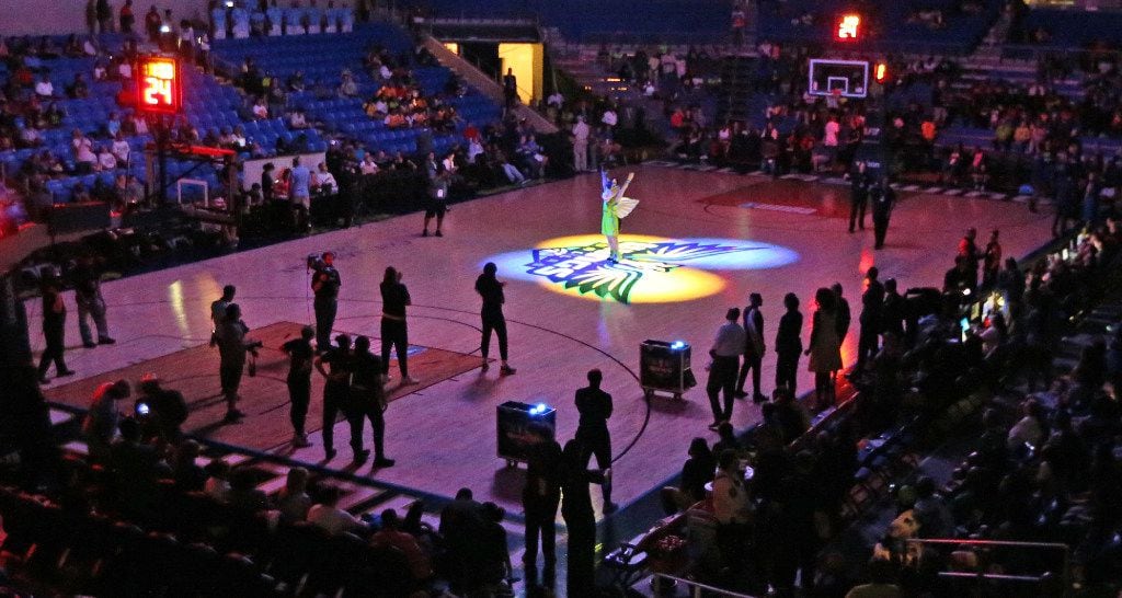Dallas Wings mascot Lightning is illuminated by spotlights before the Dallas Wings vs....