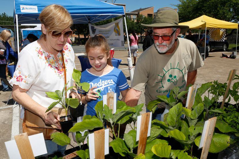 From left, Lori Martinez, Lola Martinez, 10, and Don Lambert, from Gardeners in Community...