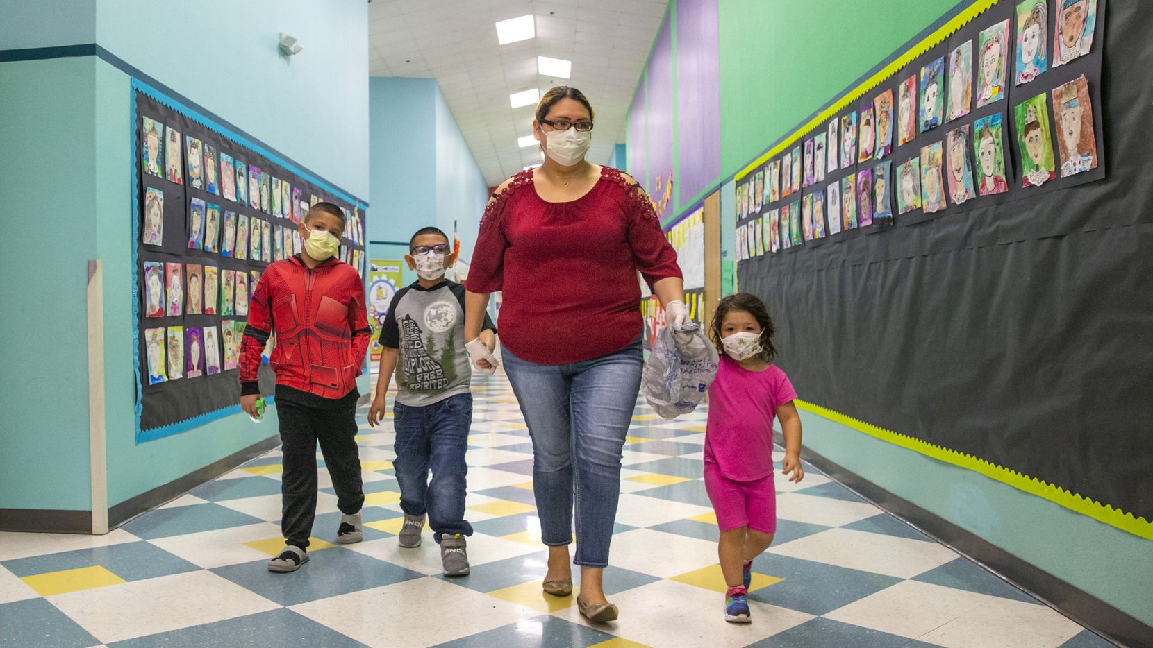 Angie Andrade (center) and her children (from left) Angel, 10, Austin, 7, and Abigail, 3,...