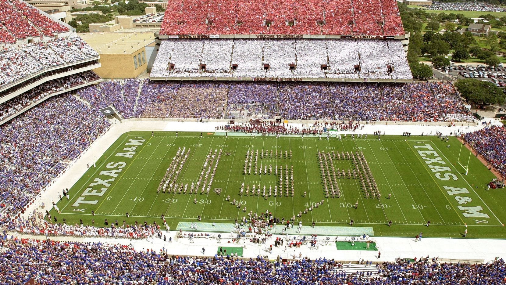 The Texas A&M band forms a "USA as fan in College Station sports red, white and blue T-shirts. Shirt sales to Saturday's crowd of 82,601, raised more than $150,000 was donated to the New York Fire Department.
