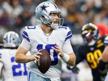 Dallas Cowboys quarterback Cooper Rush (10) looks to pass during a play in the first quarter...