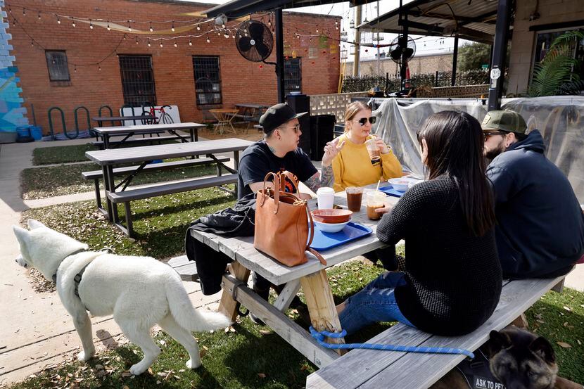 Stephen Tang, Steph Ahmed, Jared Ahmed, and Tonia Nguyen dine on the ‘lawn’ of Sandwich Hag...