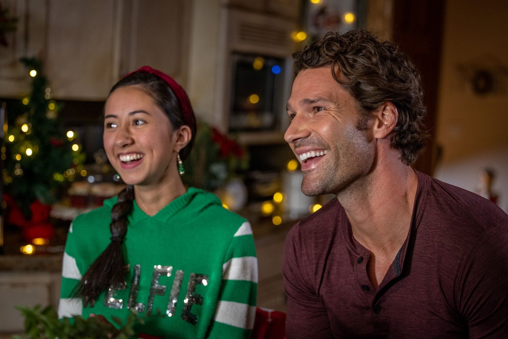 Dakota Winters (Landry Townsend) has a laugh with her uncle, Noah Winters (Aaron O’Connell) in discoveryplus’ holiday movie, Candy Coated Christmas.